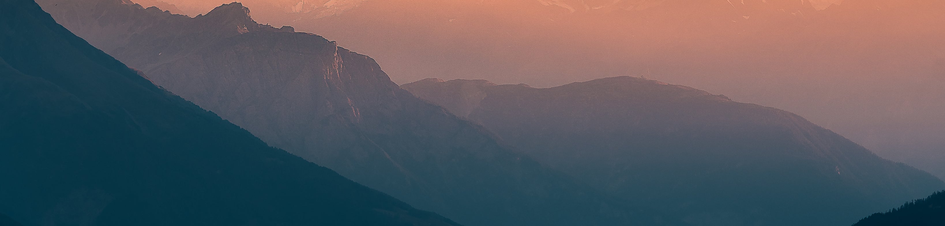 Misty mountain ranges at sunrise